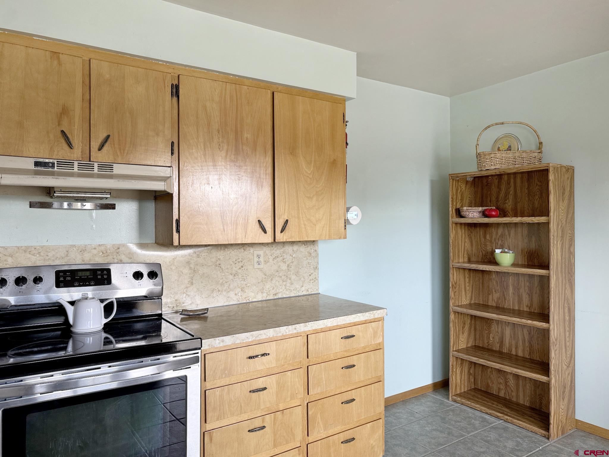 34706 Fruitland Mesa Road Crawford, CO 81415 - Photo 13 of 45 a kitchen with granite countertop cabinets and steel stainless steel appliances