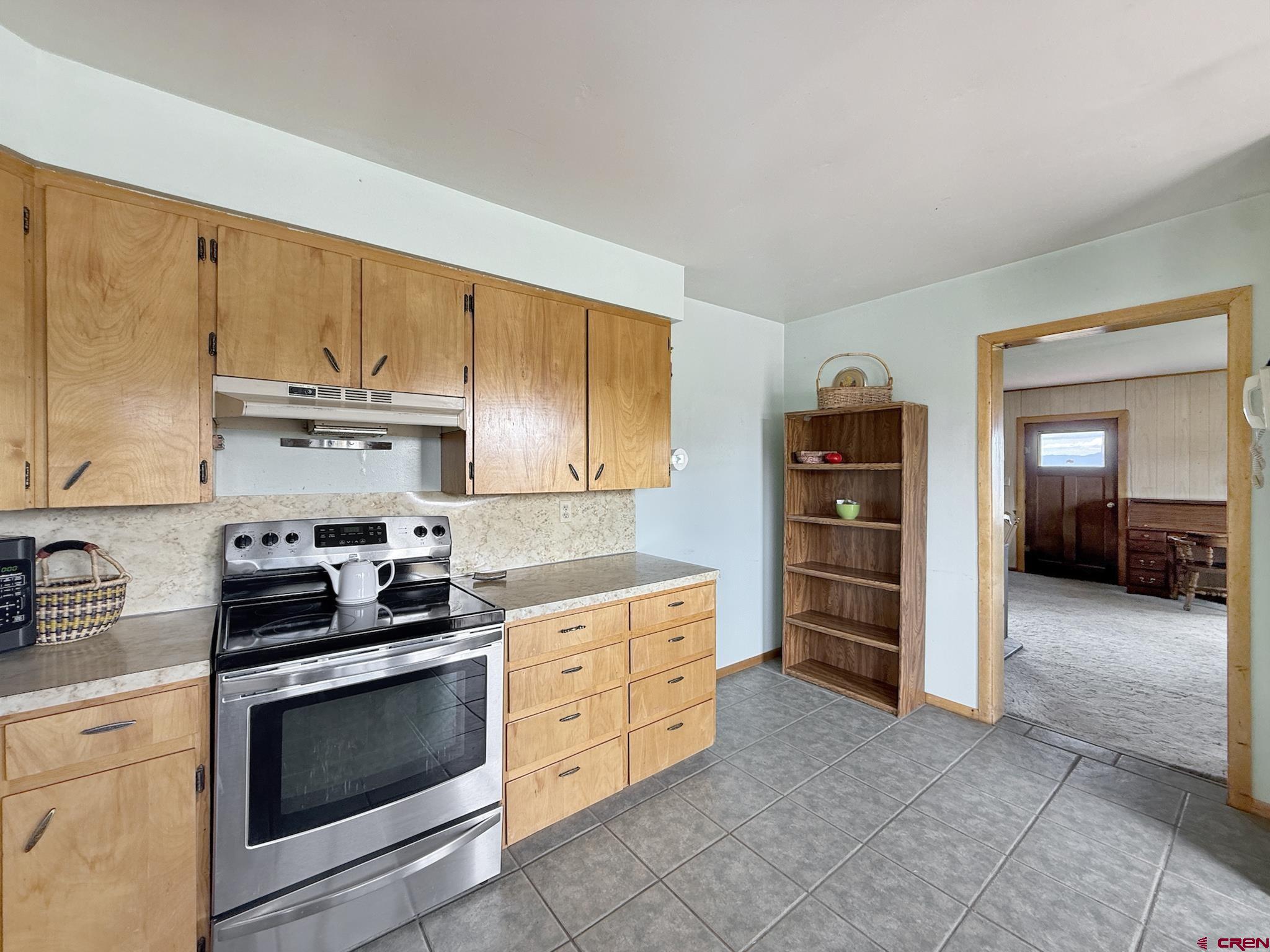 34706 Fruitland Mesa Road Crawford, CO 81415 - Photo 14 of 45 a kitchen with stainless steel appliances a stove a sink and a cabinets
