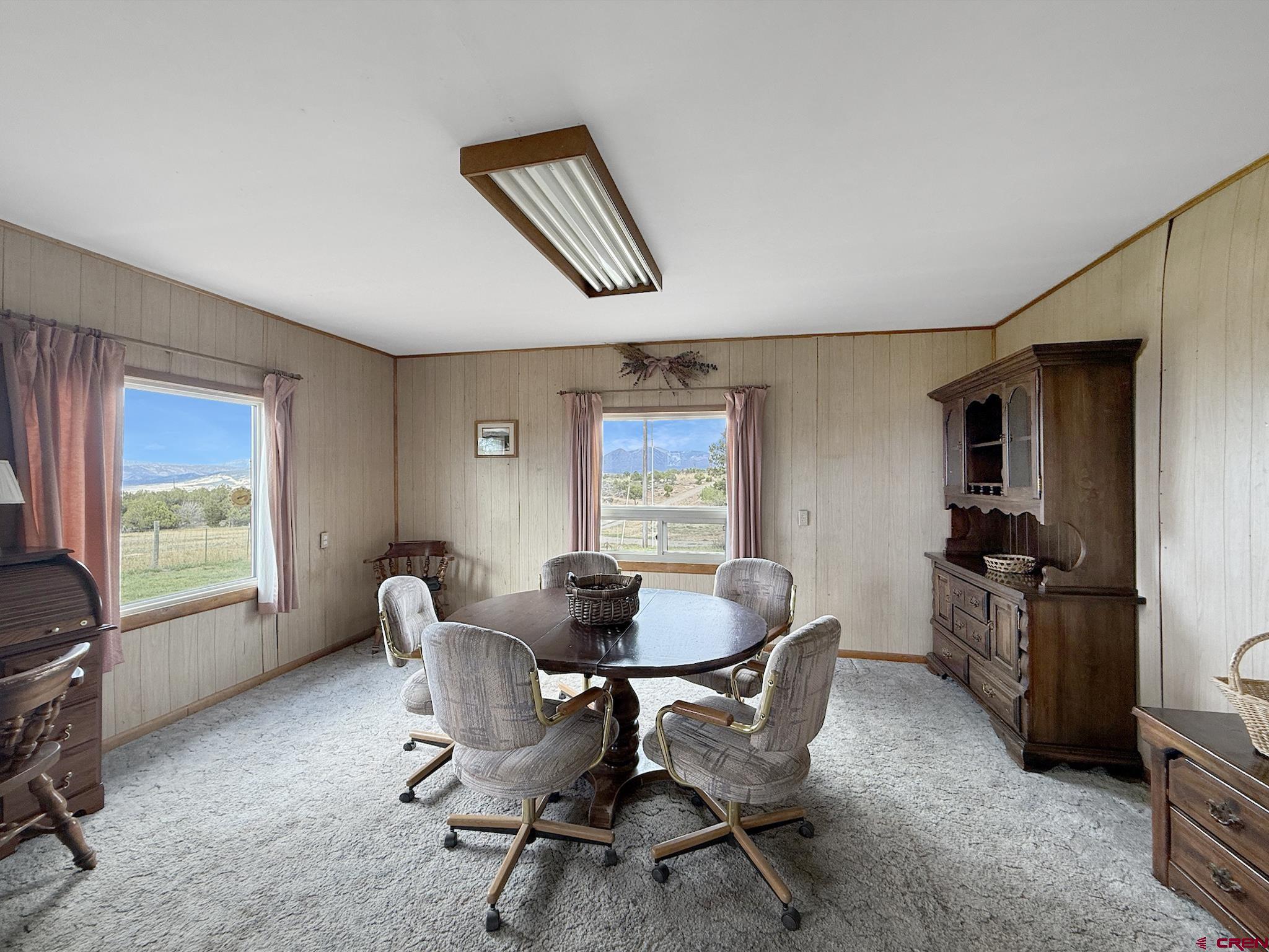 34706 Fruitland Mesa Road Crawford, CO 81415 - Photo 17 of 45 a workspace with furniture and a window