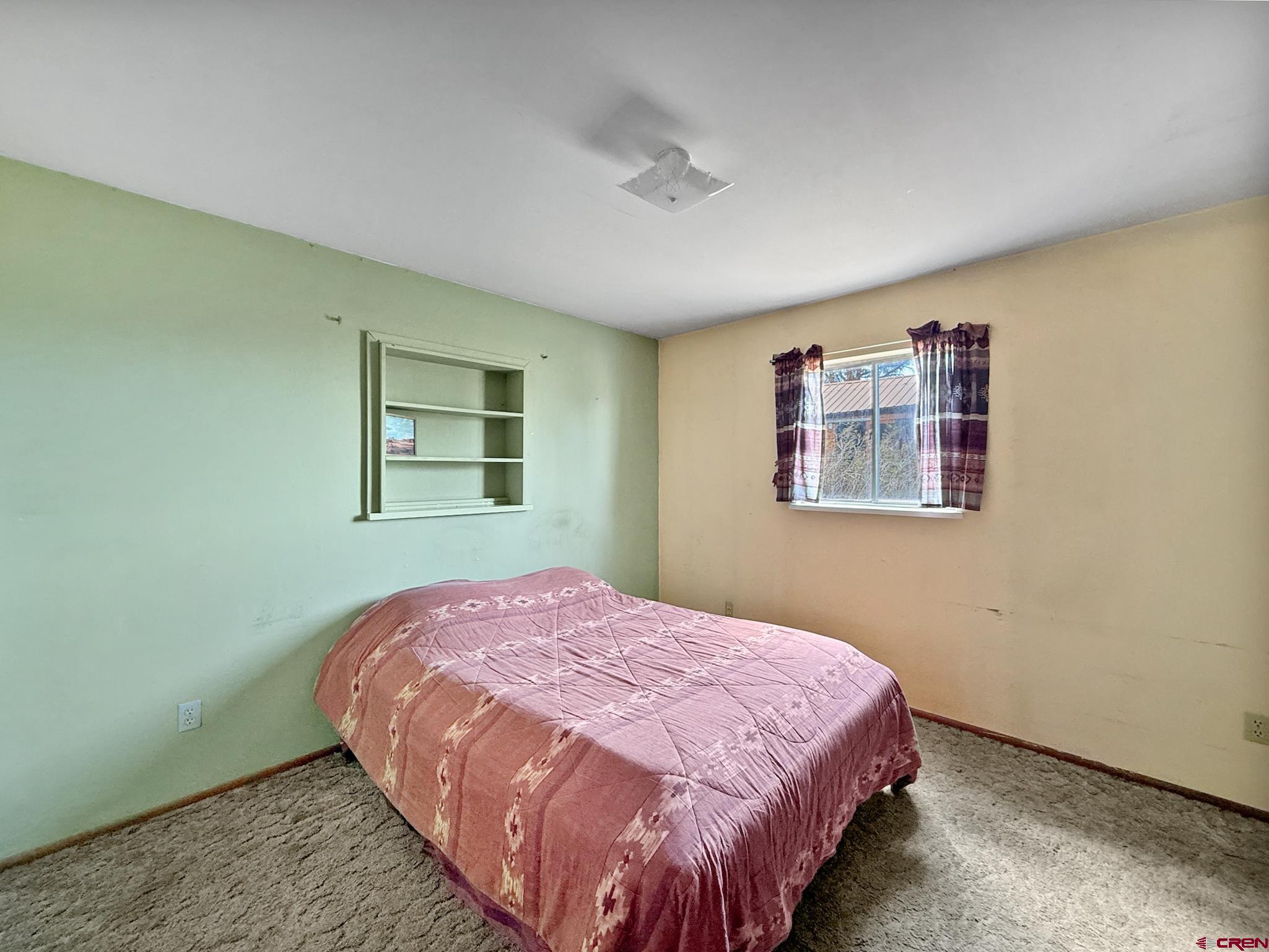 34706 Fruitland Mesa Road Crawford, CO 81415 - Photo 23 of 45 a bedroom with a bed and a window