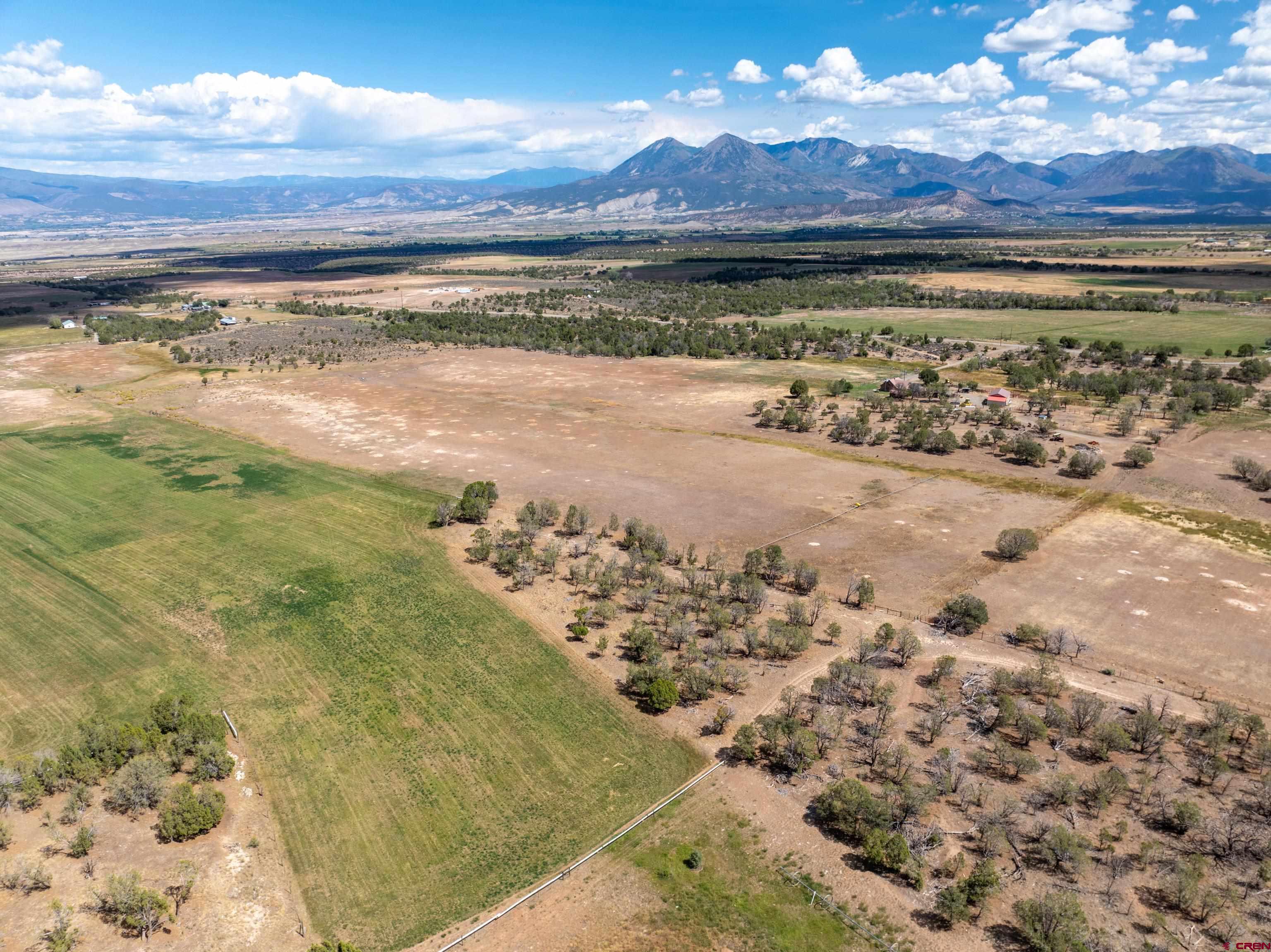 34706 Fruitland Mesa Road Crawford, CO 81415 - Photo 25 of 45 a view of a yard with an ocean view