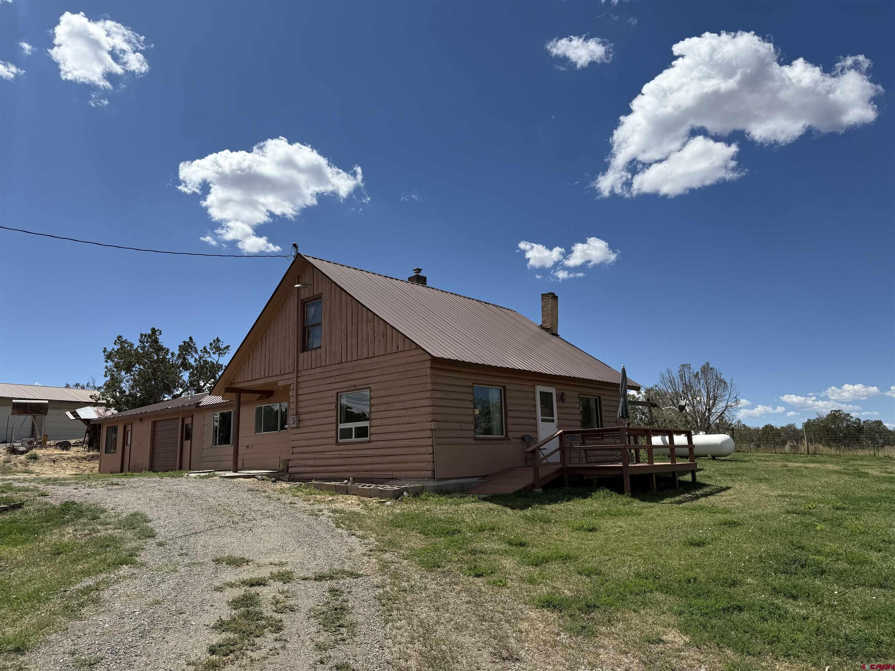 34706 Fruitland Mesa Road Crawford, CO 81415 - Photo 3 of 45 a house view with a seating space