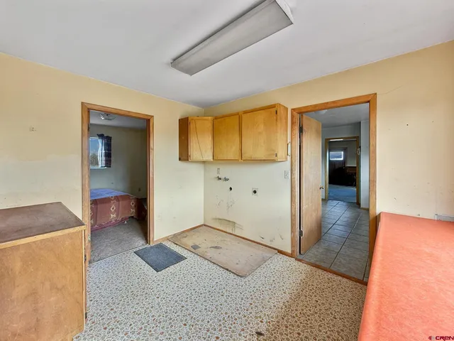 a view of a hallway with stairs