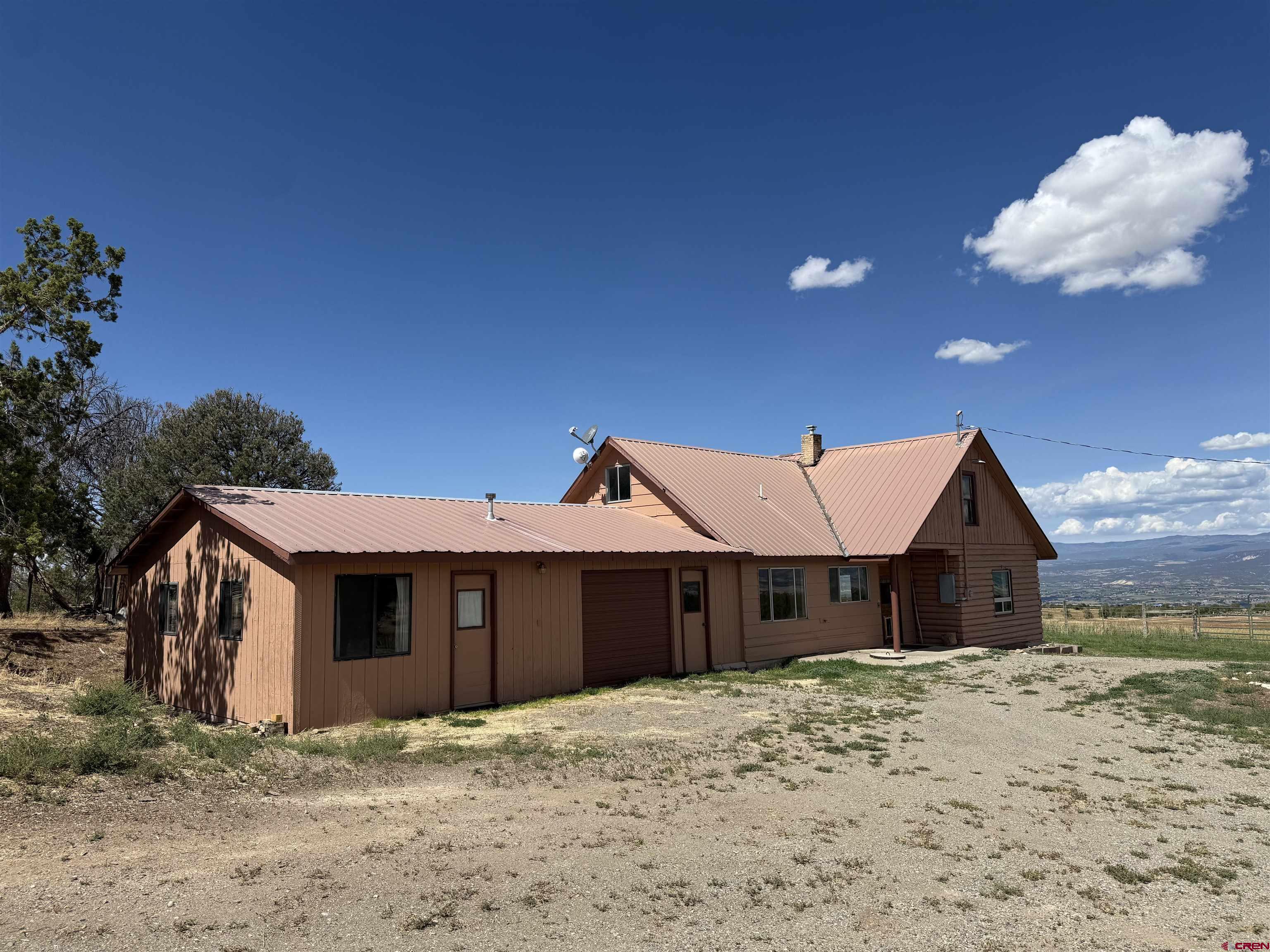 34706 Fruitland Mesa Road Crawford, CO 81415 - Photo 40 of 45 a view of a house with a yard