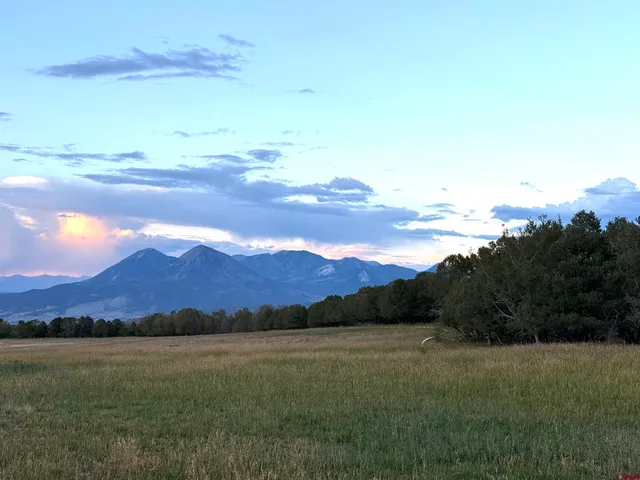 a view of lake with mountain in the back
