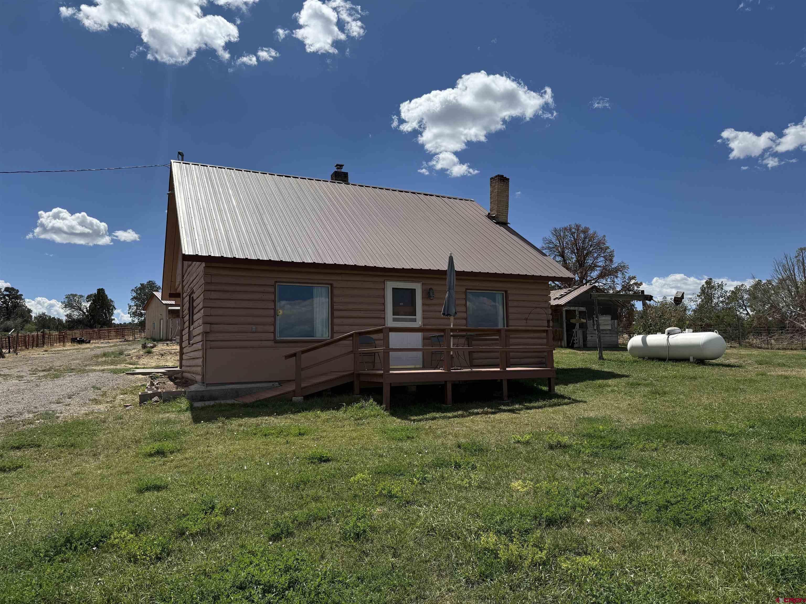 34706 Fruitland Mesa Road Crawford, CO 81415 - Photo 44 of 45 a house view with a garden