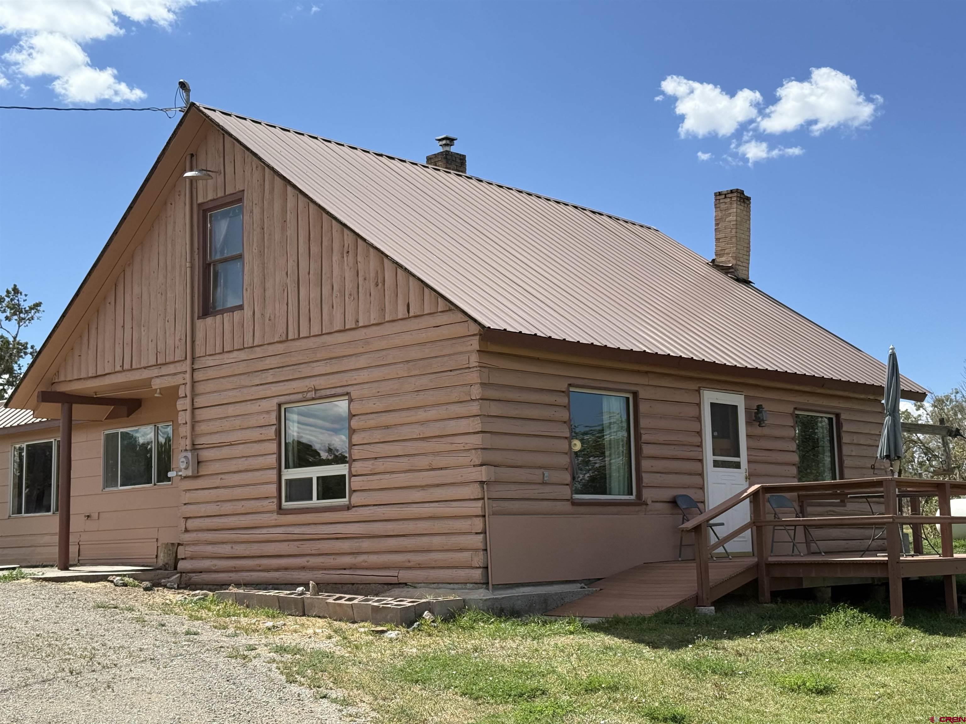 34706 Fruitland Mesa Road Crawford, CO 81415 - Photo 45 of 45 a view of a house with a backyard