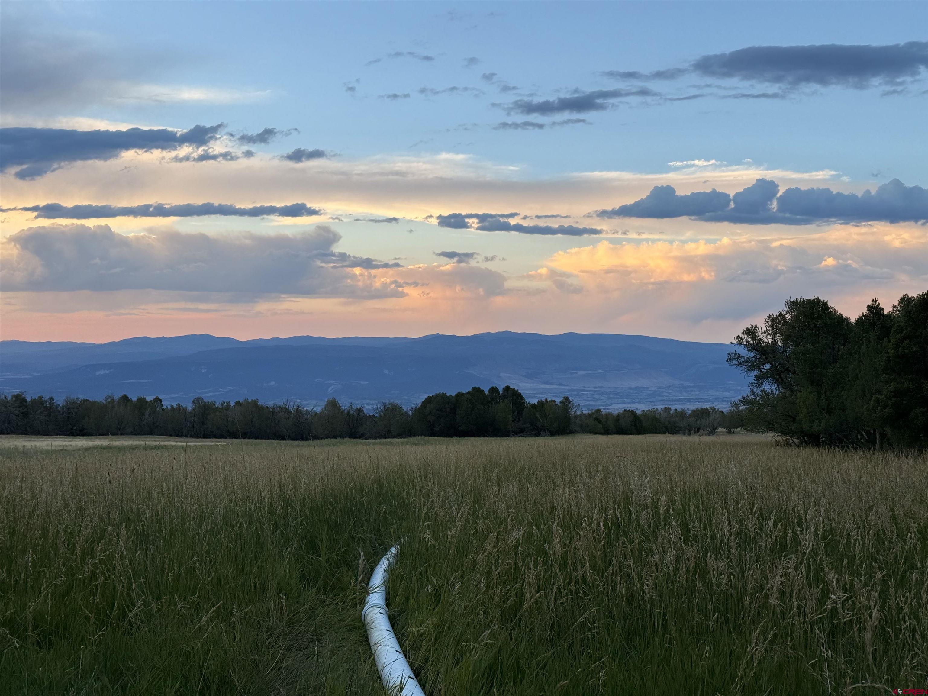 34706 Fruitland Mesa Road Crawford, CO 81415 - Photo 5 of 45 a view of lake with mountain in the back