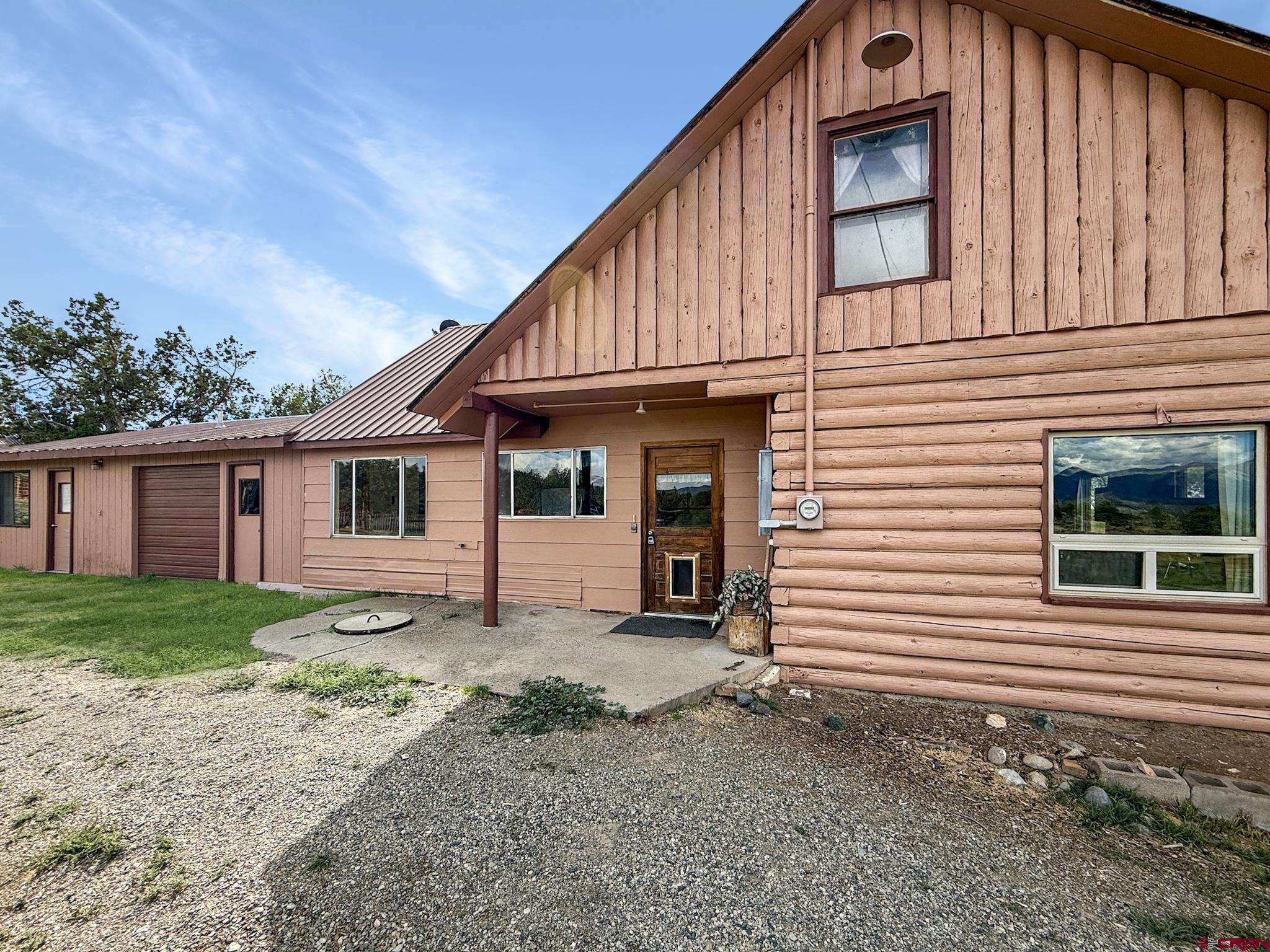 34706 Fruitland Mesa Road Crawford, CO 81415 - Photo 10 of 45 a view of a house with backyard and garden