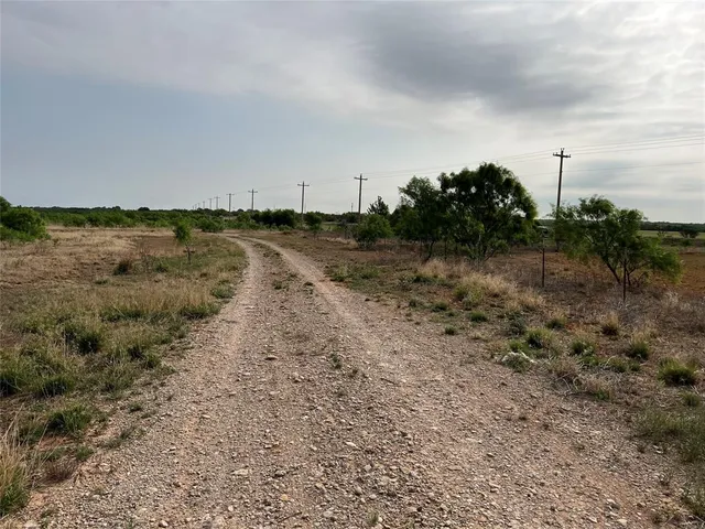 a view of a lake with trees in the background