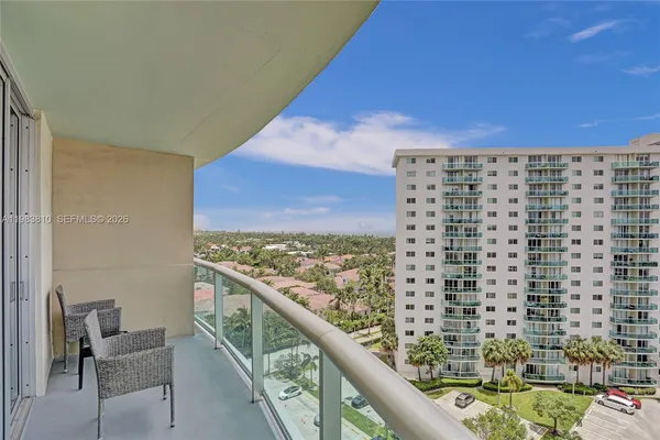 a view of balcony with furniture