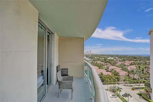a bathroom with a toilet a sink a mirror a shower a vanity and window