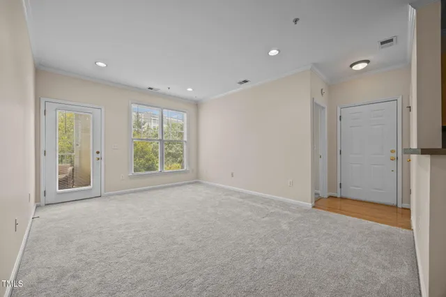 a view of an empty room with a window