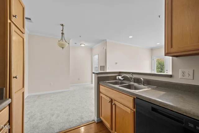 a kitchen with a sink and a window