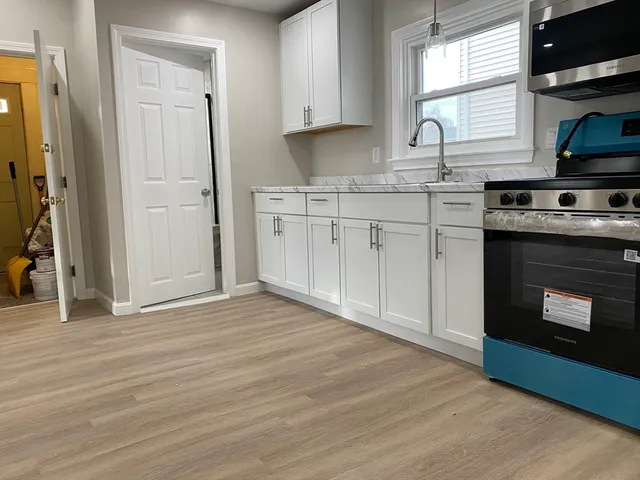 a kitchen with a stove and a microwave