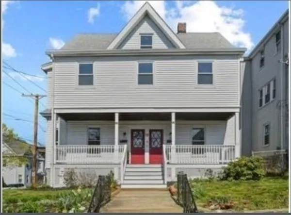 a front view of a house with glass windows