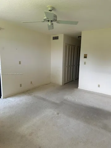 a view of cabinets with wooden floor