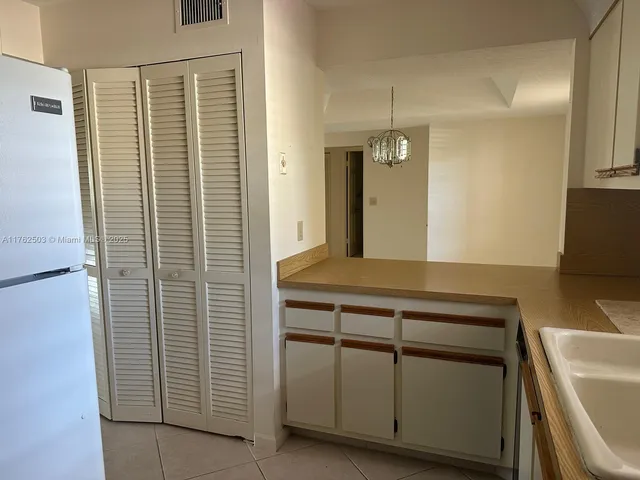 a spacious bathroom with a sink and a mirror