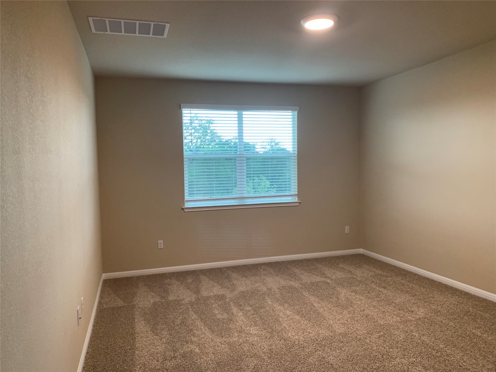 100 Royal Palm Way Leander, TX 78641 - Photo 11 of 29 an empty room with a window