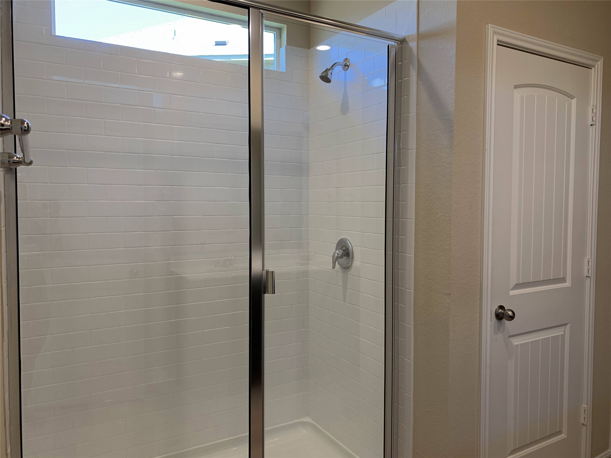100 Royal Palm Way Leander, TX 78641 - Photo 12 of 29 Bathroom with a shower stall and a textured wall