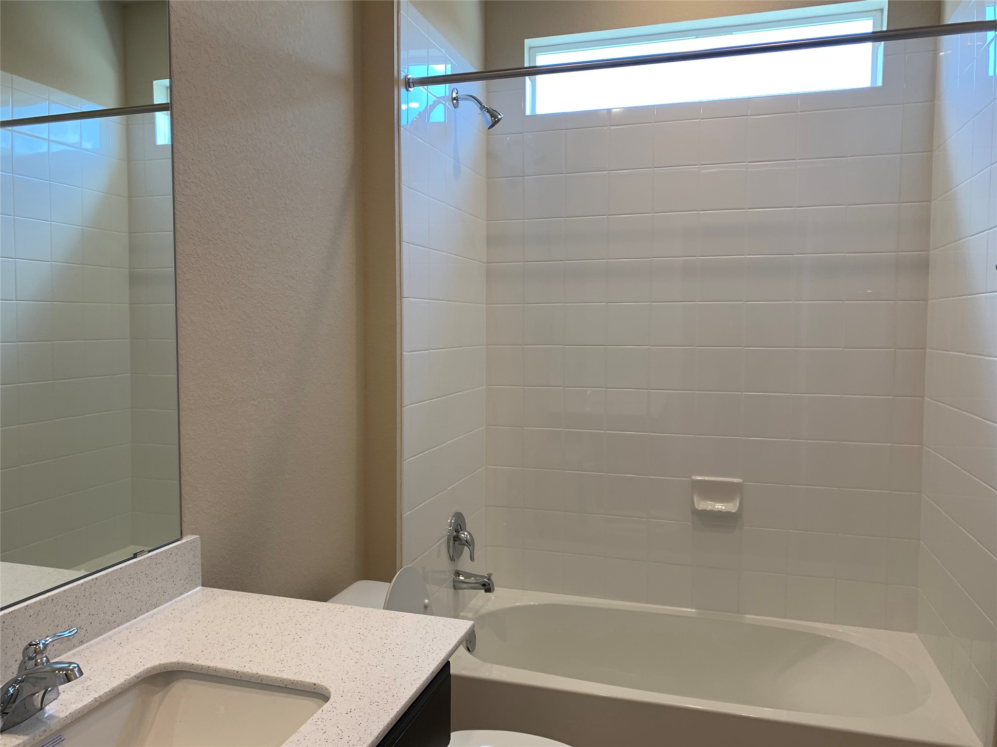 100 Royal Palm Way Leander, TX 78641 - Photo 15 of 29 Full bath with toilet, vanity, a textured wall, and shower / bathing tub combination