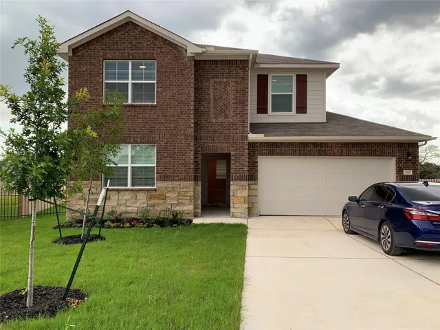 a car parked in front of a house