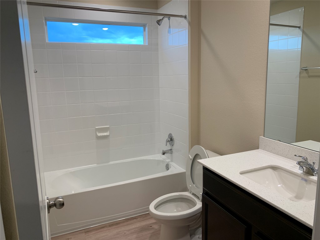 100 Royal Palm Way Leander, TX 78641 - Photo 22 of 29 a bathroom with a sink a toilet and shower