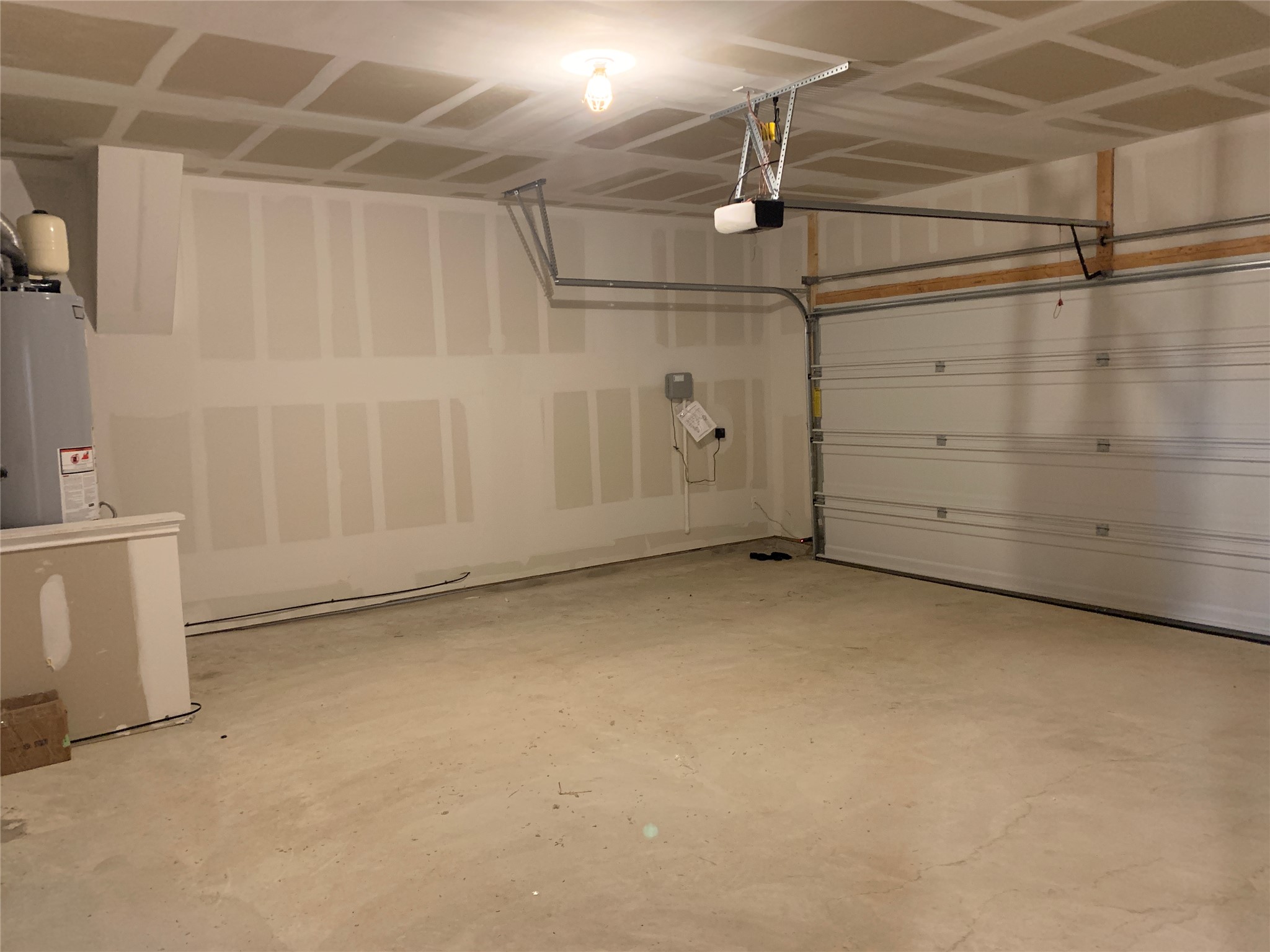 100 Royal Palm Way Leander, TX 78641 - Photo 24 of 29 Garage featuring gas water heater and a garage door opener
