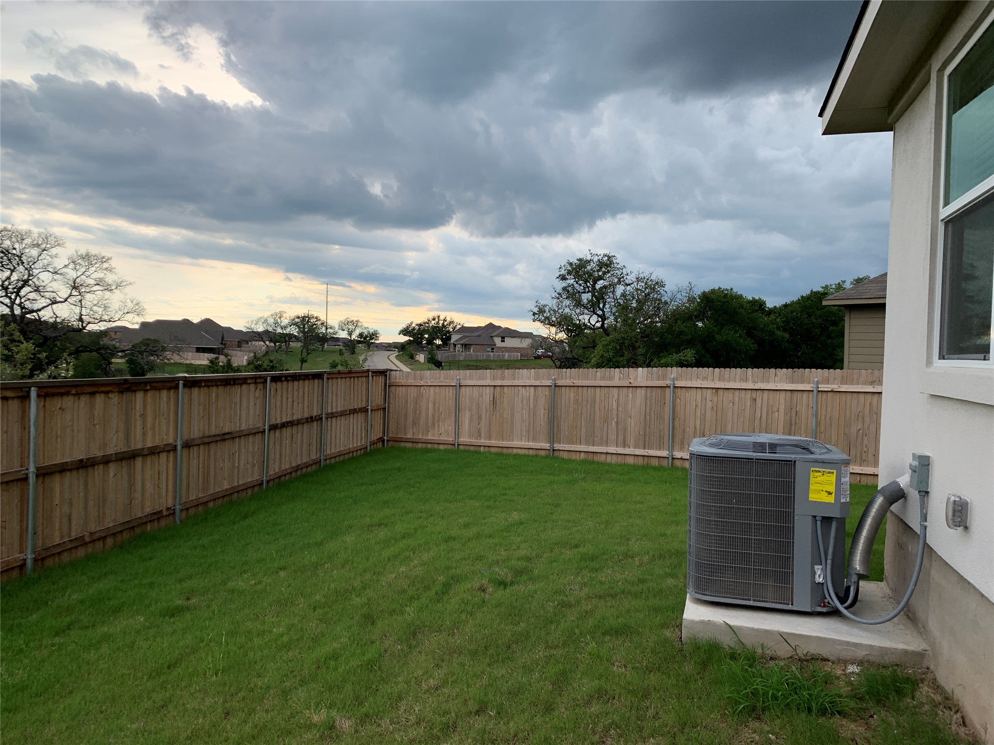 100 Royal Palm Way Leander, TX 78641 - Photo 26 of 29 View of yard with cooling unit and a fenced backyard