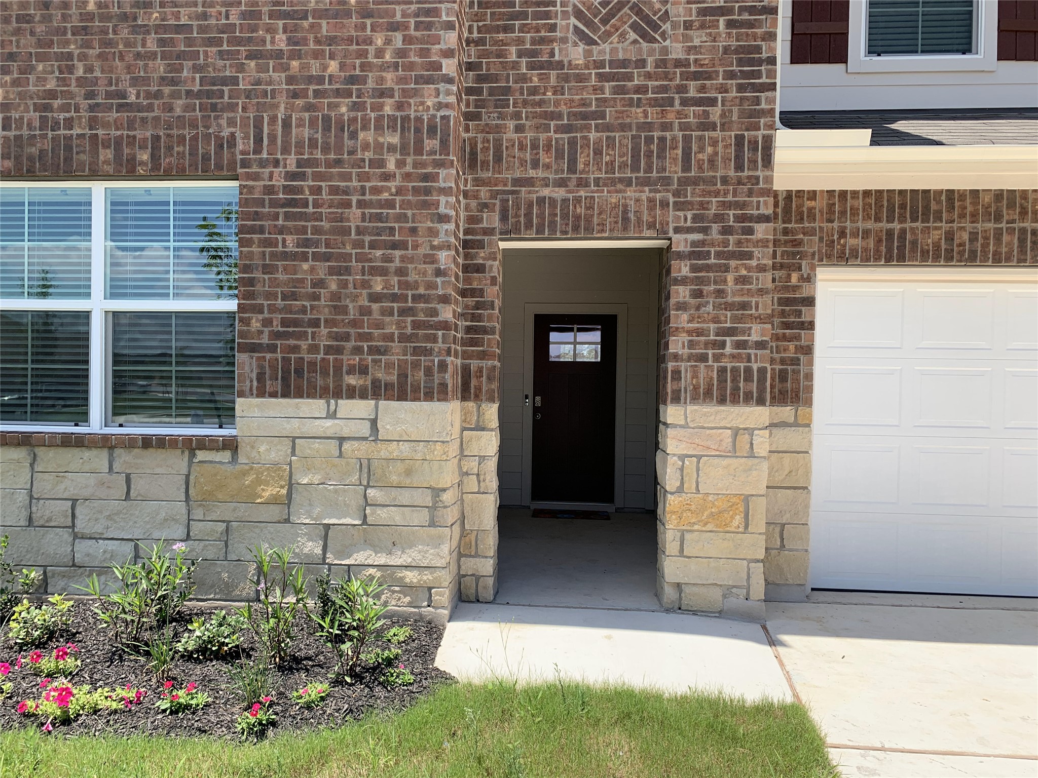 100 Royal Palm Way Leander, TX 78641 - Photo 3 of 29 Property entrance with a garage and brick siding