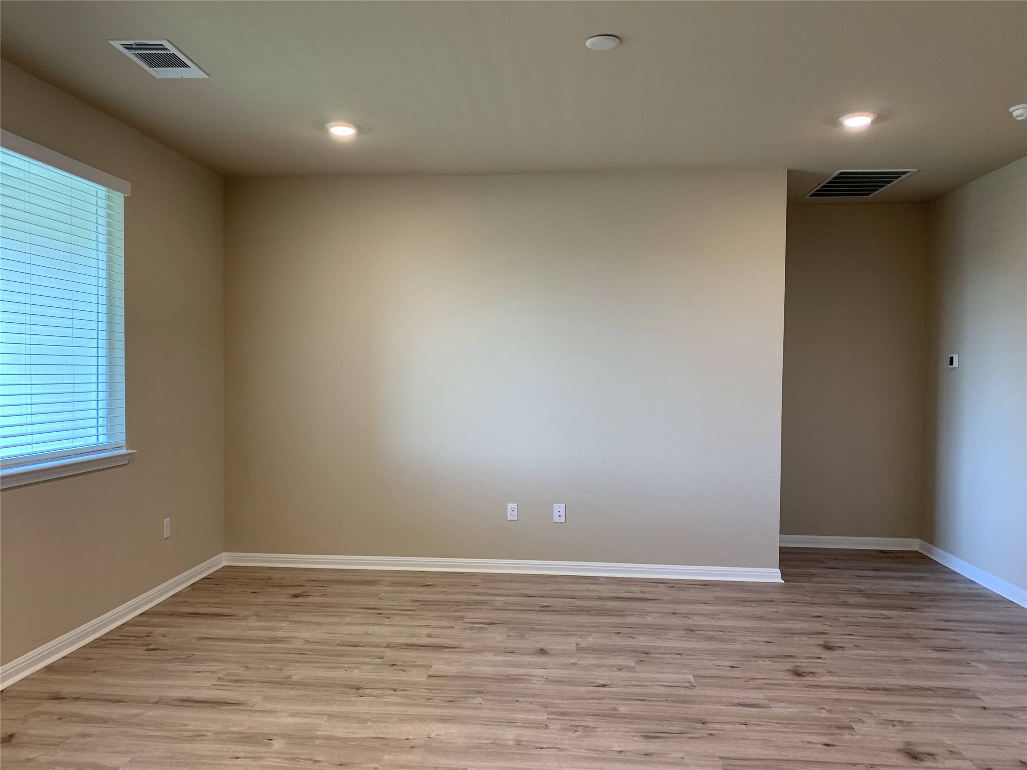 100 Royal Palm Way Leander, TX 78641 - Photo 9 of 29 Unfurnished room featuring recessed lighting, baseboards, light wood finished floors, and visible vents