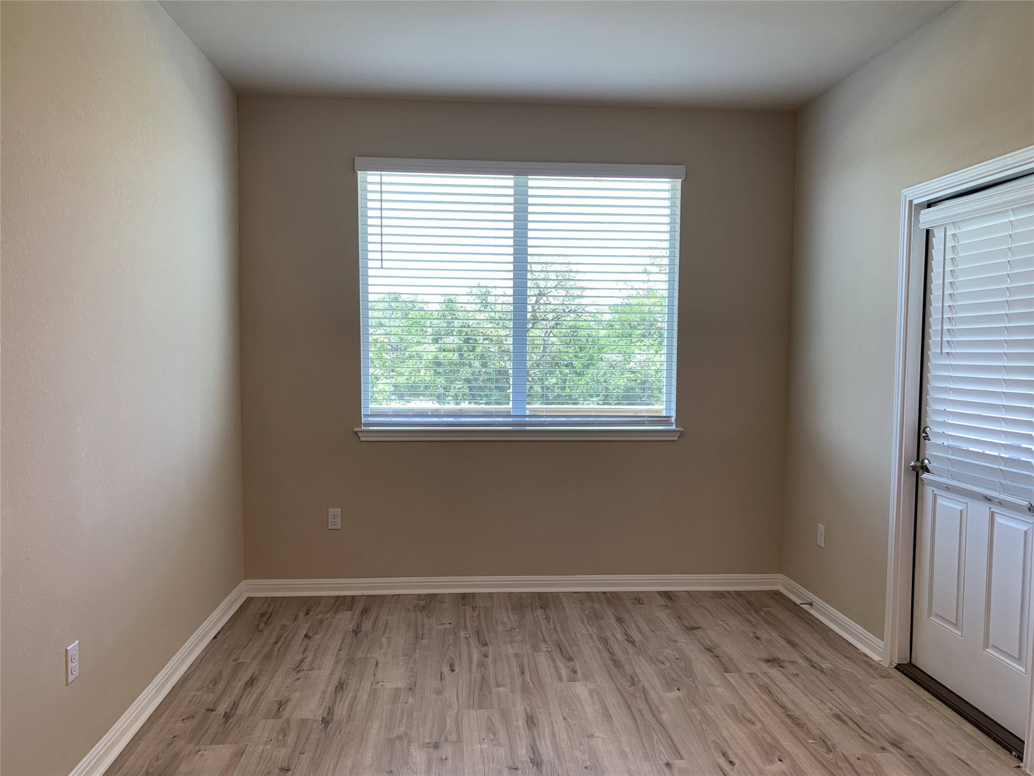 100 Royal Palm Way Leander, TX 78641 - Photo 10 of 29 Spare room featuring baseboards and light wood-style flooring