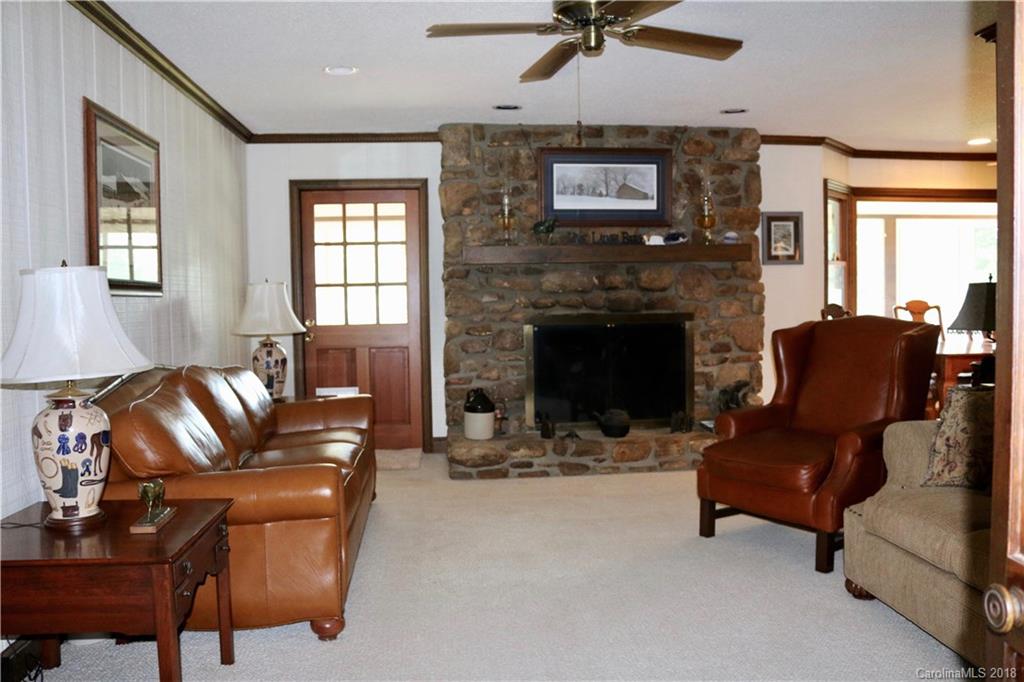 1274 Blacksnake Road Stanley, NC 28164 - Photo 11 of 34 a living room with furniture and a fireplace
