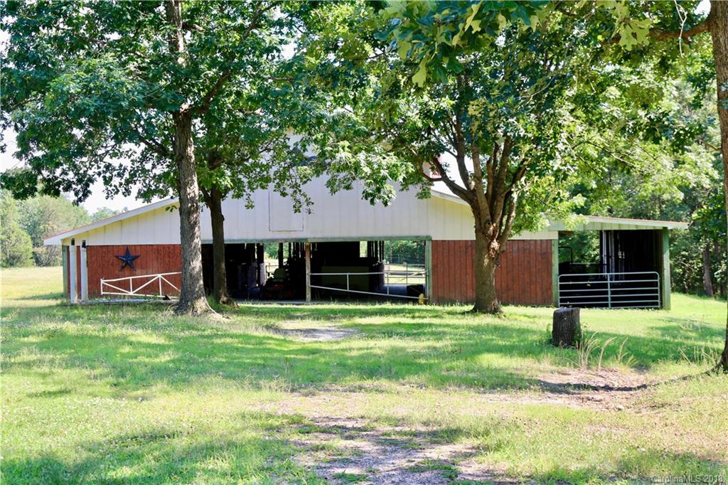 1274 Blacksnake Road Stanley, NC 28164 - Photo 21 of 34 a view of a house with a yard