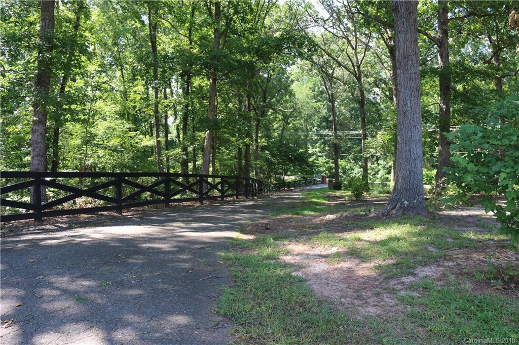 1274 Blacksnake Road Stanley, NC 28164 - Photo 26 of 34 a view of a yard with a tree