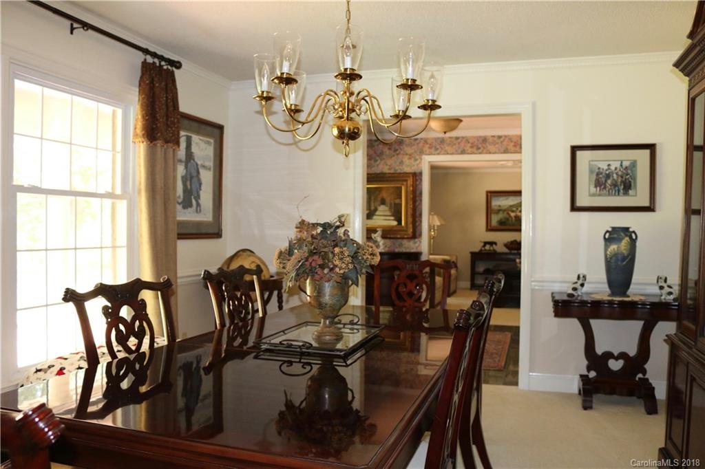 1274 Blacksnake Road Stanley, NC 28164 - Photo 4 of 34 a view of a dining room with furniture and a chandelier