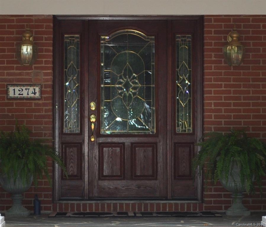 1274 Blacksnake Road Stanley, NC 28164 - Photo 31 of 34 a front view of a house with a glass door