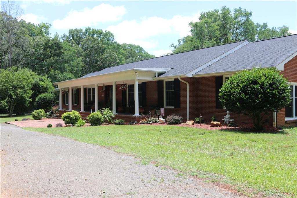 1274 Blacksnake Road Stanley, NC 28164 - Photo 32 of 34 a view of a house with backyard and sitting area