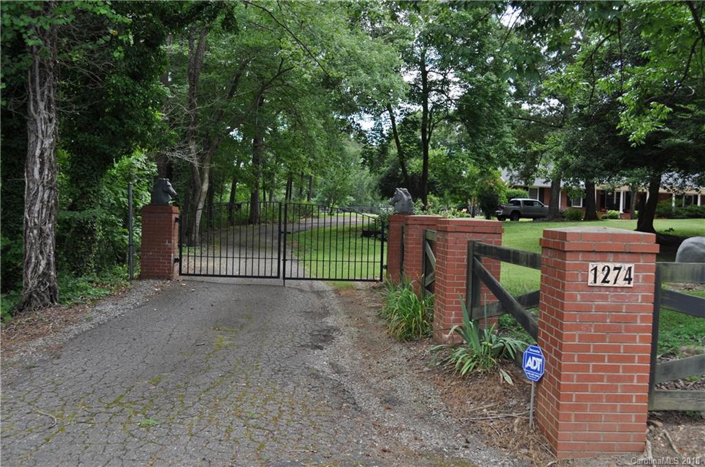 1274 Blacksnake Road Stanley, NC 28164 - Photo 34 of 34 a view of a street with large trees