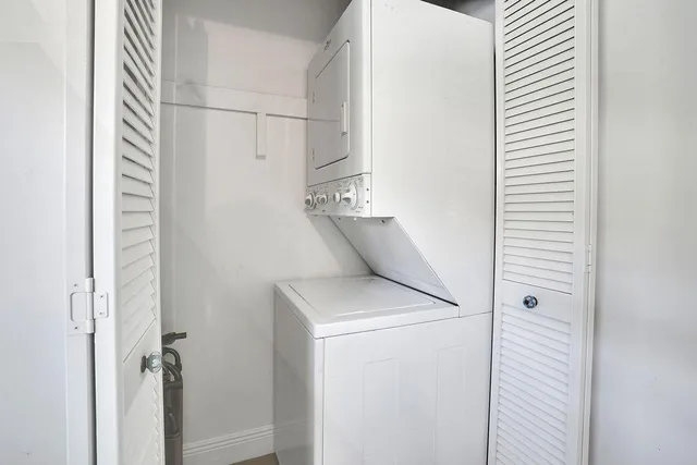 a bed room with a bed and a night stand