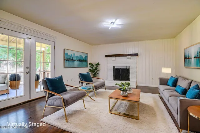a bedroom with a bed potted plant and a window