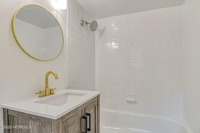 a bedroom with bed and a potted plant