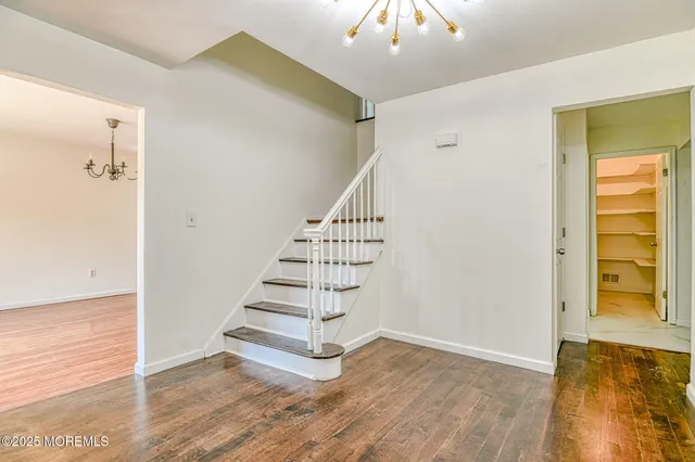 a open kitchen with granite countertop a stove top oven sink and cabinets