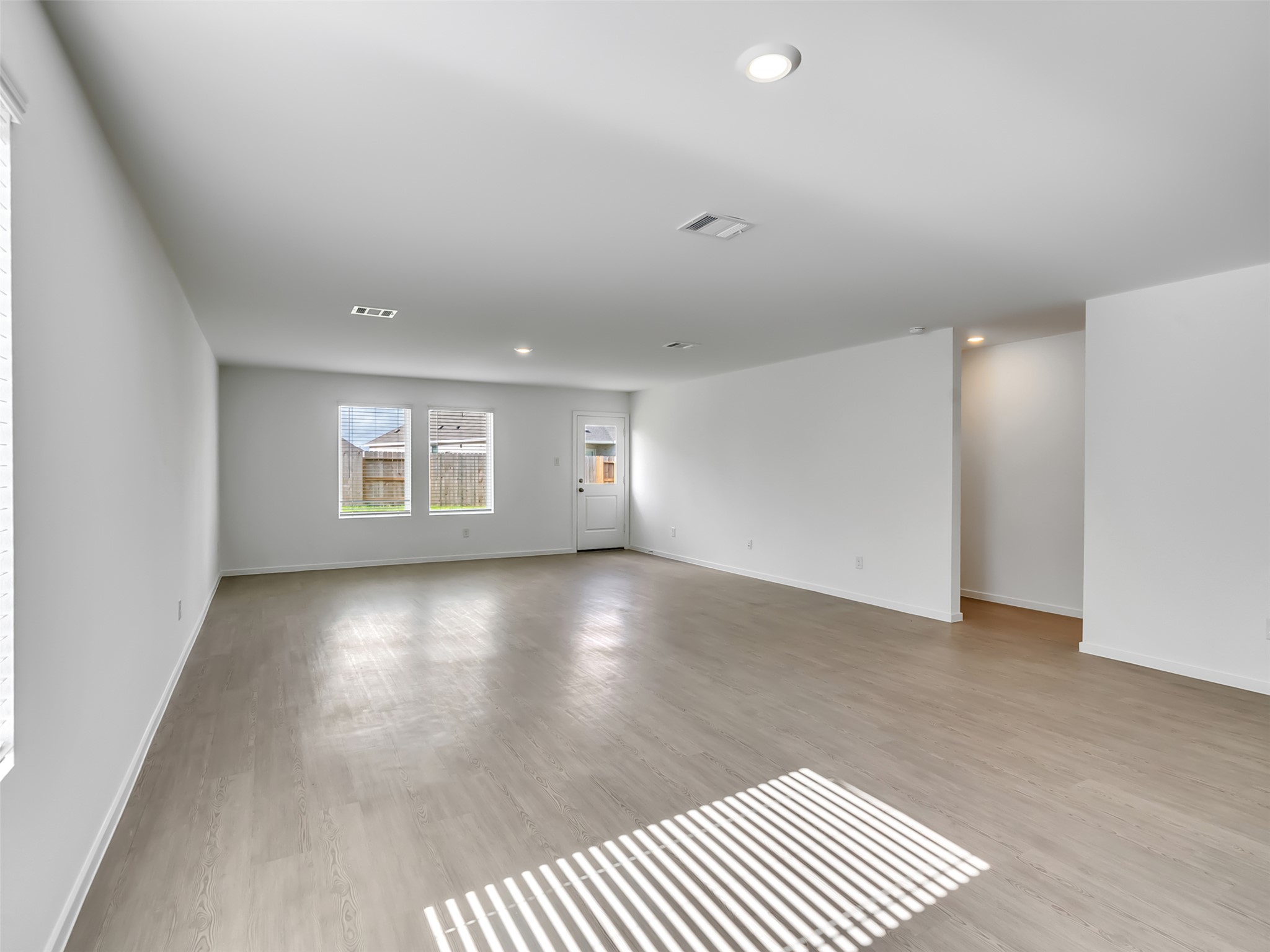 3041 Colusa Rdg Drive Katy, TX 77493 - Photo 21 of 26 an empty room with windows and white walls
