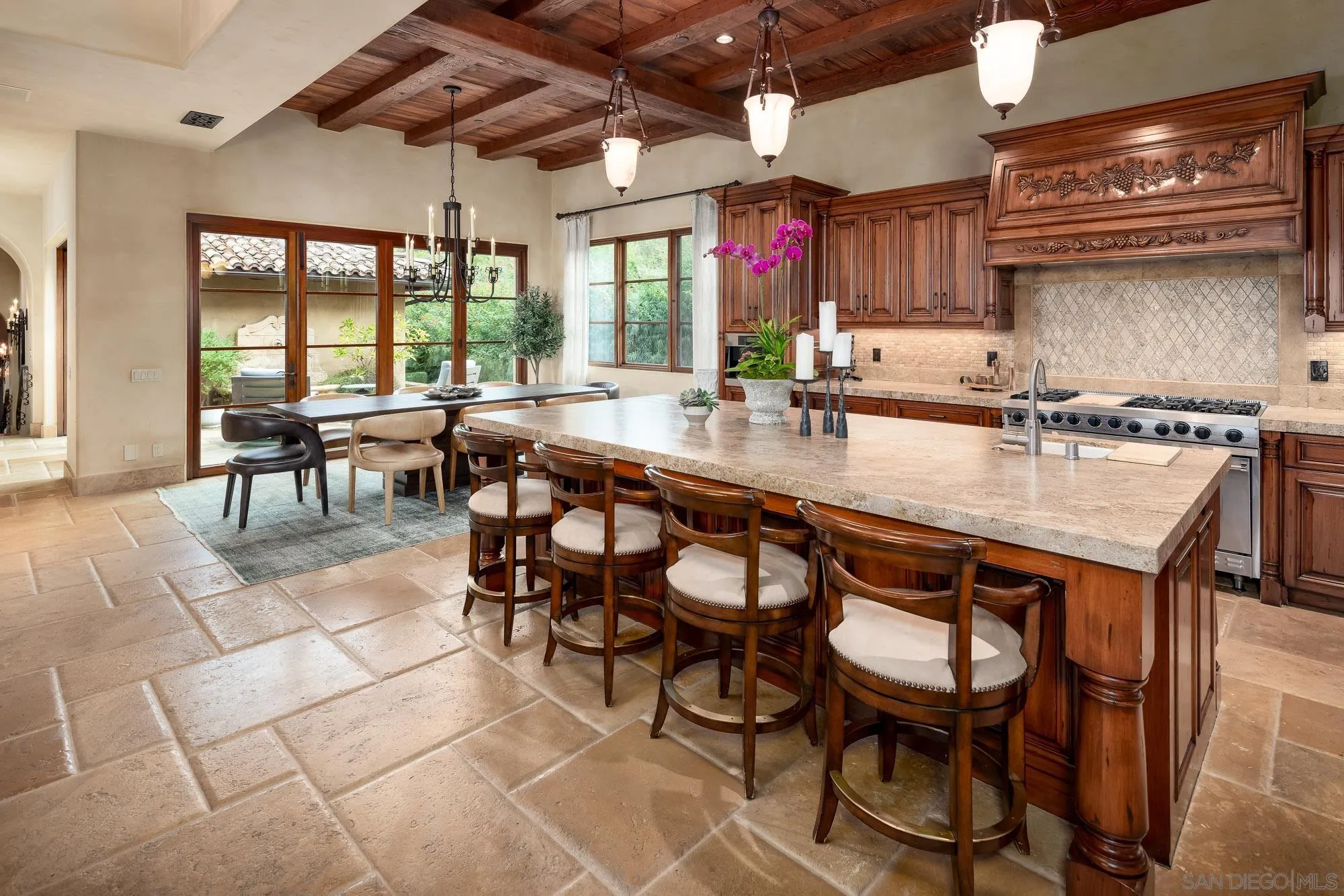 6309 Strada Fragante Rancho Santa Fe, CA 92091 - Photo 16 of 49 a kitchen with a dining table and chairs