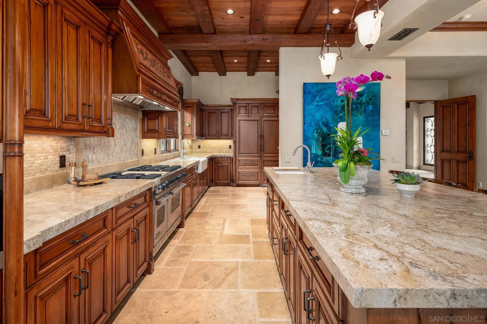 6309 Strada Fragante Rancho Santa Fe, CA 92091 - Photo 17 of 49 a large kitchen with stainless steel appliances granite countertop lots of counter top space