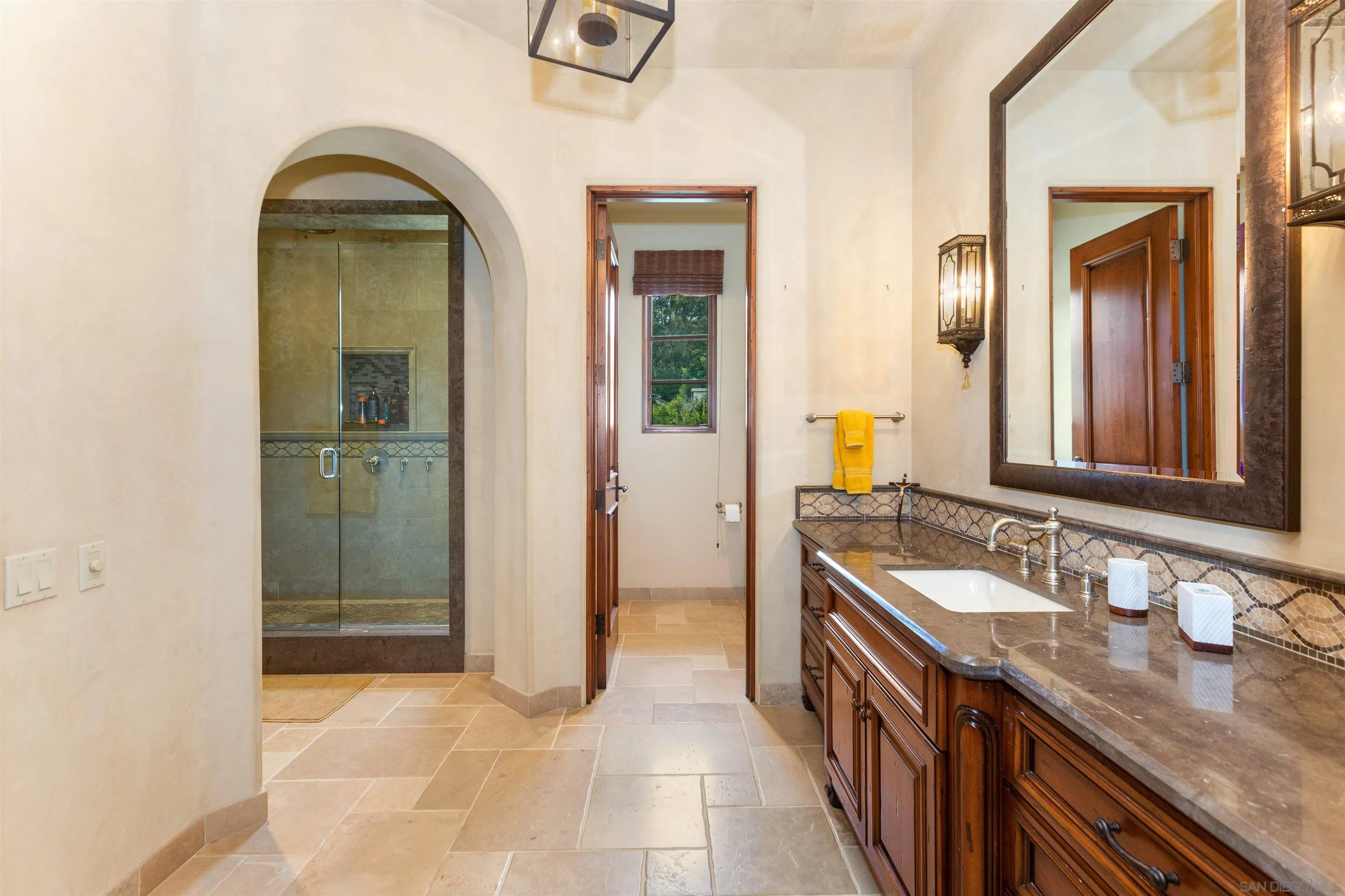 6309 Strada Fragante Rancho Santa Fe, CA 92091 - Photo 27 of 49 a bathroom with a sink a vanity and a mirror