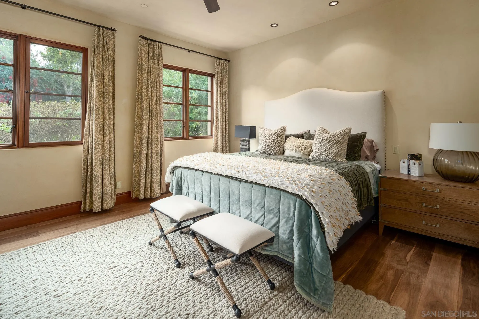 6309 Strada Fragante Rancho Santa Fe, CA 92091 - Photo 30 of 49 a bedroom with a bed a mirror and a window