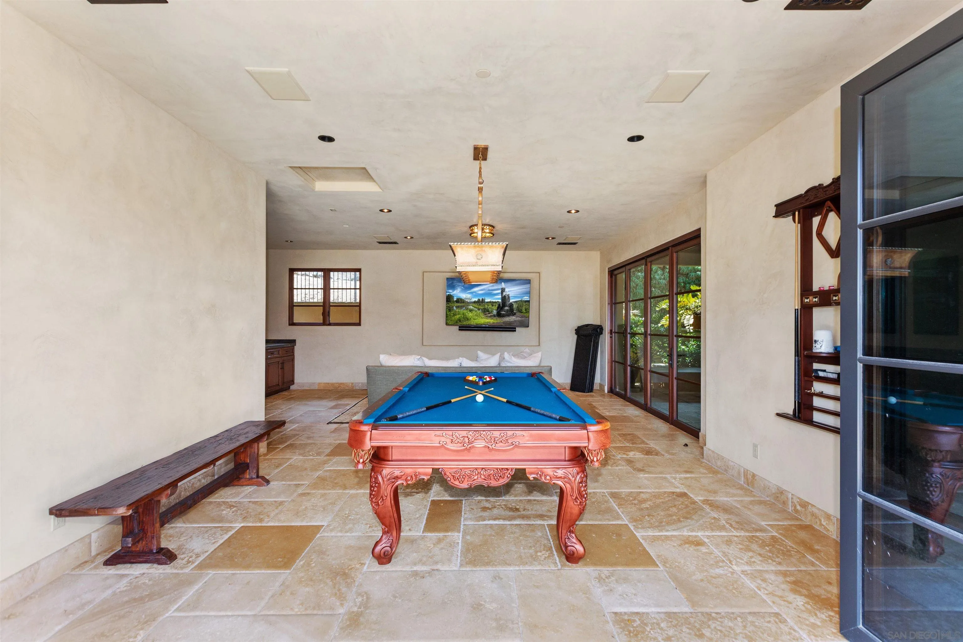 6309 Strada Fragante Rancho Santa Fe, CA 92091 - Photo 40 of 49 a living room with furniture a rug and a flat screen tv