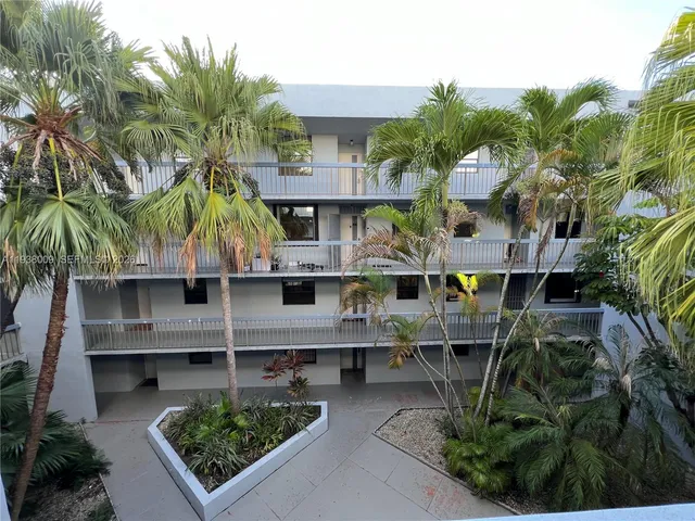 a view of backyard of house with outdoor seating